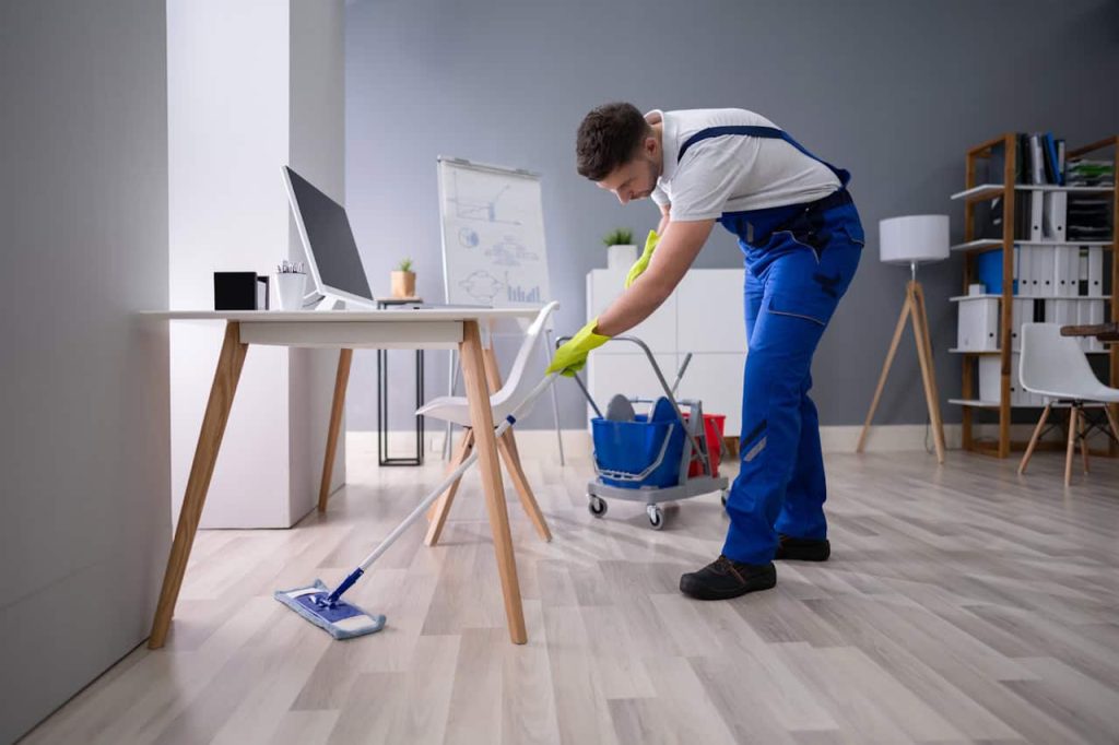 cleaner doing a professional cleaning in an office